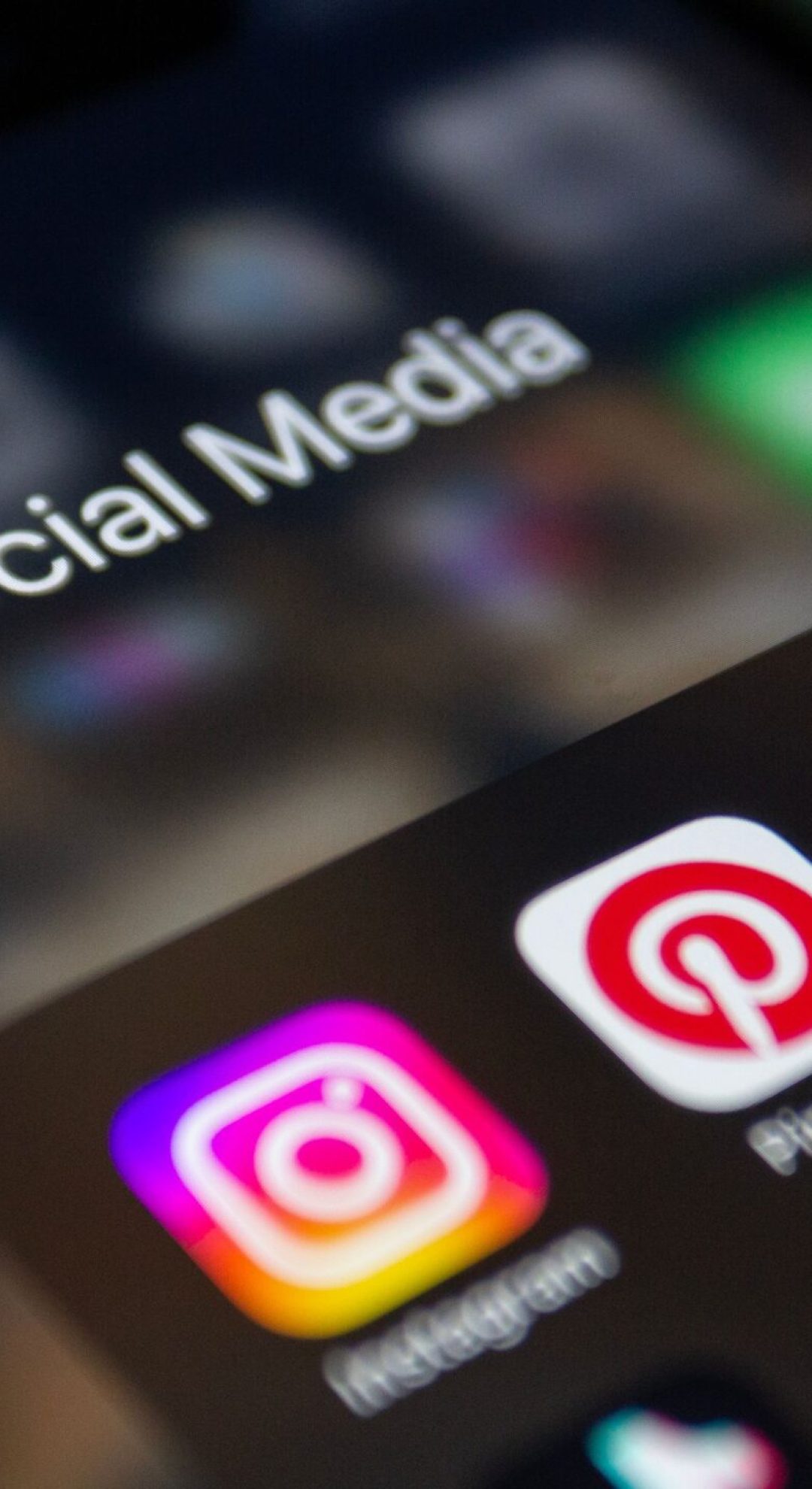 A smartphone screen displaying popular social media applications like Instagram and Twitter.